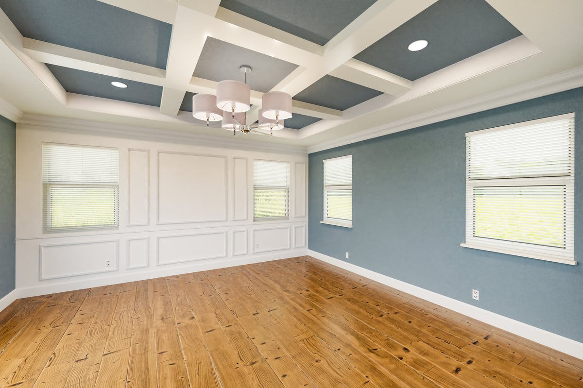 Detail of freshly painted trim, baseboards, and wainscoting in a bedroom